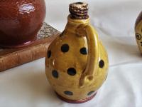 Redware Jug with Black Dots and Corn Cob Stopper