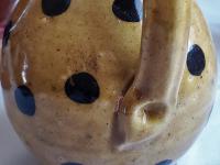 Redware Jug with Black Dots and Corn Cob Stopper
