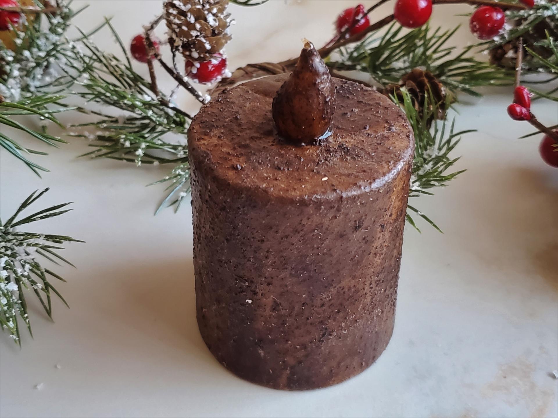 Warm and Cozy Winter Decor: Burnt Mustard Timer Pillar with Snowy Pine and Red Berries Candle Ring