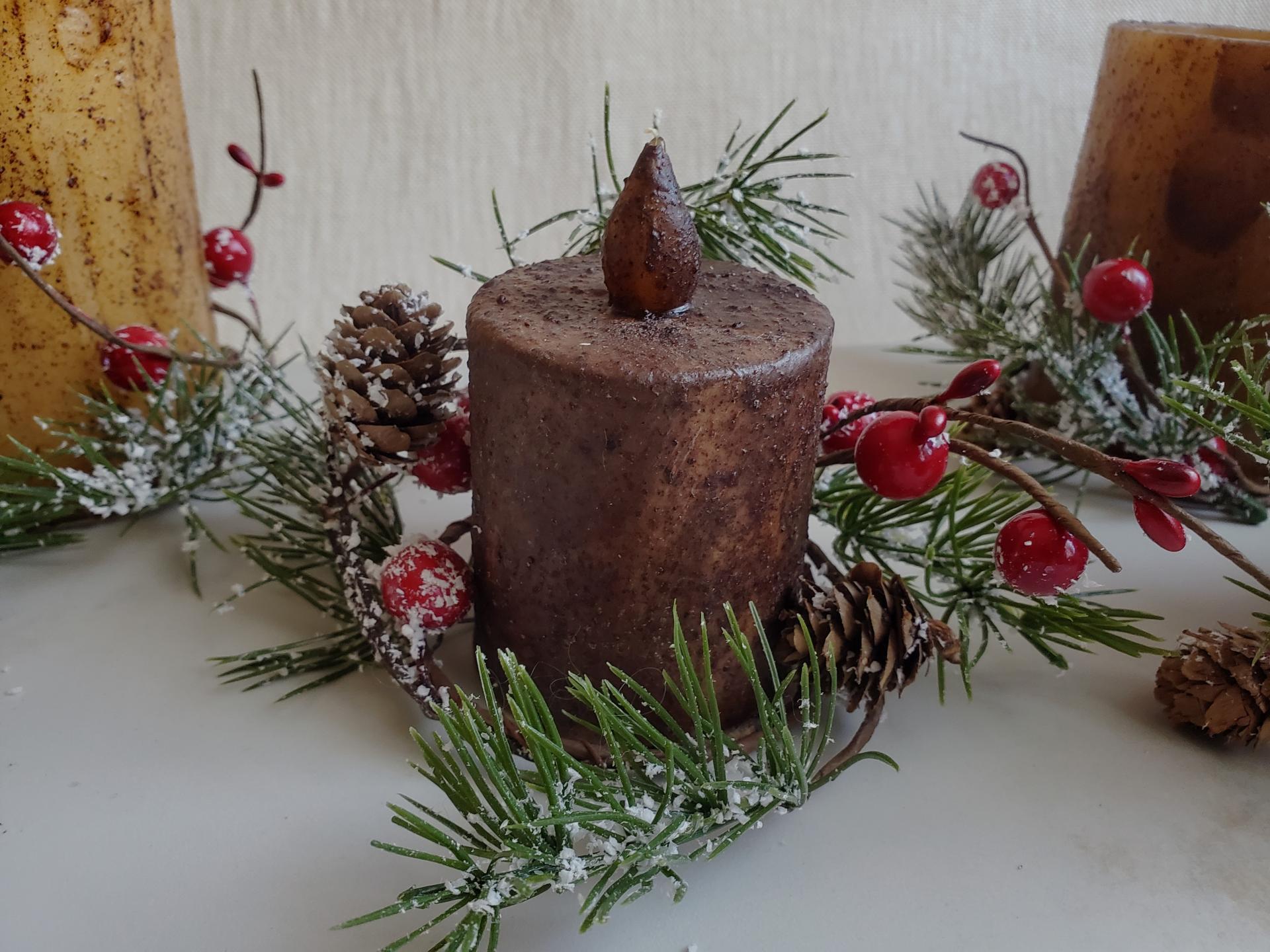 Warm and Cozy Winter Decor: Burnt Mustard Timer Pillar with Snowy Pine and Red Berries Candle Ring