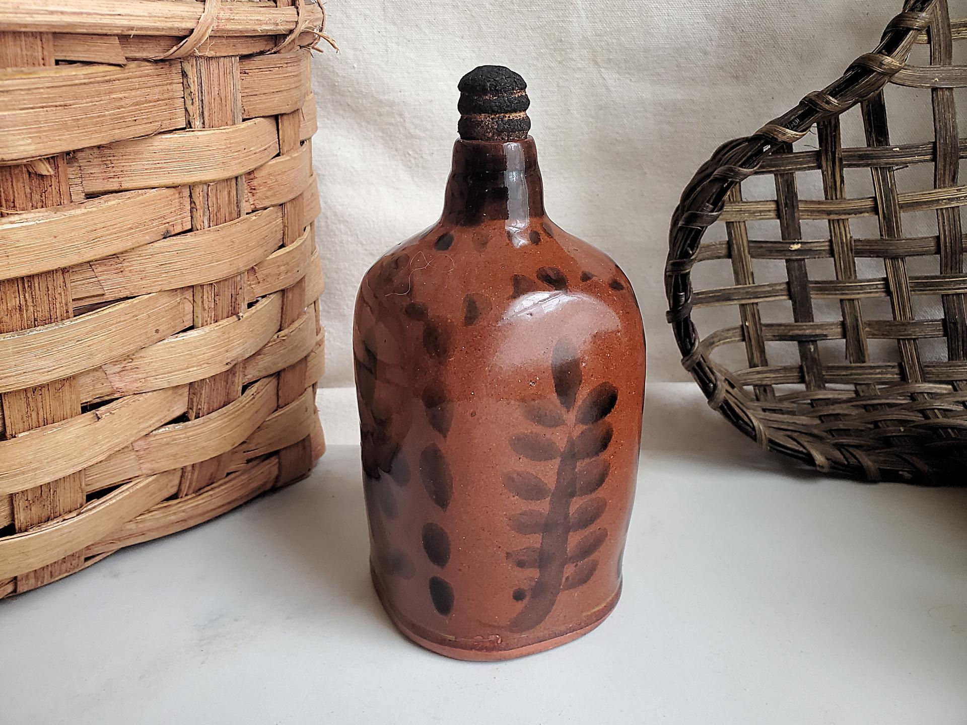 Redware Bottle and Stopper with Black Floral Motif and Square Bottom