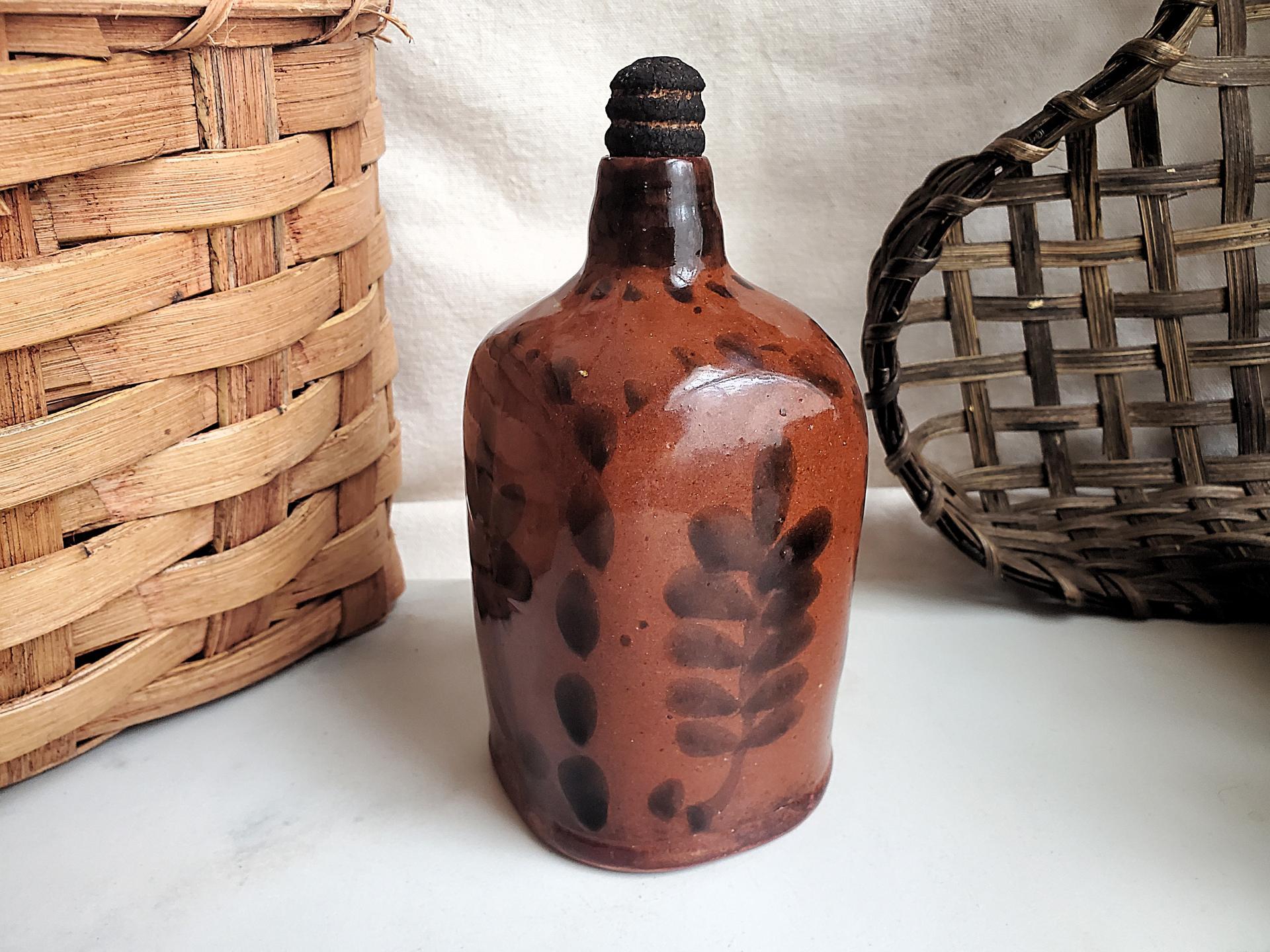 Redware Bottle and Stopper with Black Floral Motif and Square Bottom