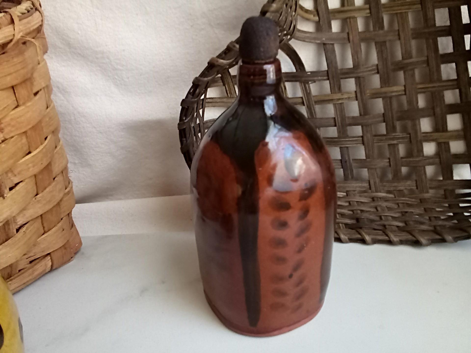 Redware Bottle and Stopper with Black Motif and Square Bottom