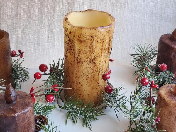 Cozy Farmhouse Winter Decor: Rustic Pillar Candle with Snowy Pine and Red Berry Candle Ring