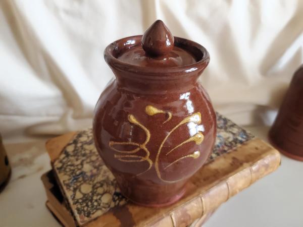 Redware 5 in Storage Jar with Feather Pattern and Acorn Finial