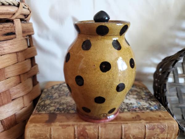 Redware 5 in Storage Jar with Black Dots and Acorn Finial