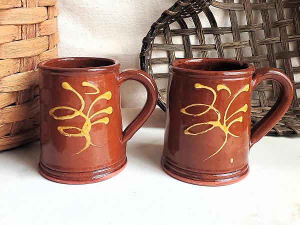 Two Slip-Decorated Redware Mugs with Feather Motif (a)