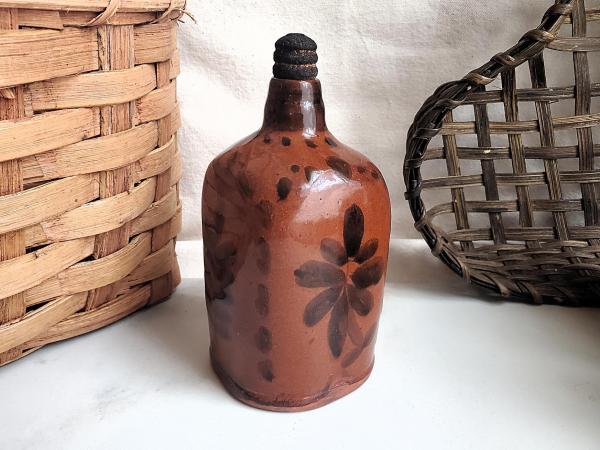 Redware Bottle and Stopper with Black Floral Motif and Square Bottom